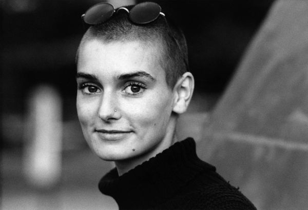 A black and white, head and shoulders portrait of the late Sinead O'Connor from circa 1989